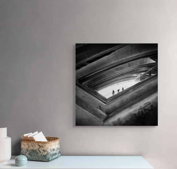 concrete rhythm - woman ascending through brutalist parking structure in palma